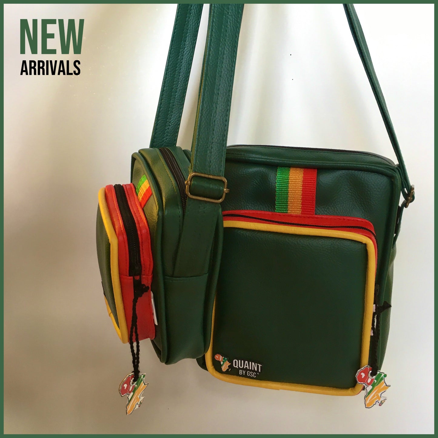 emerald handmade leatherette sling bags with red yellow and green reggae colors down the middle.