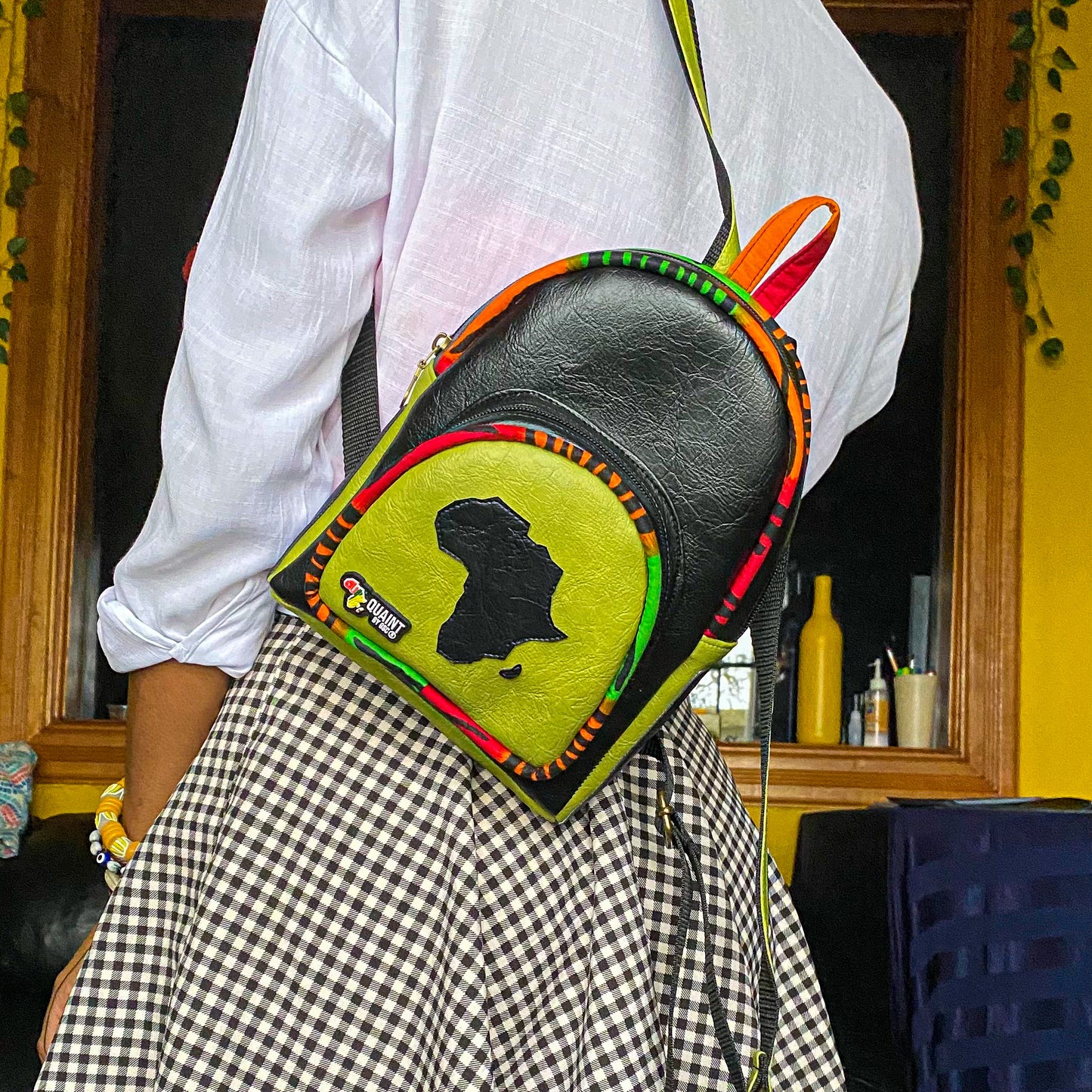 Bitesize Backpack. Cute black and chatreuse green backpack with a map of Africa on the front.