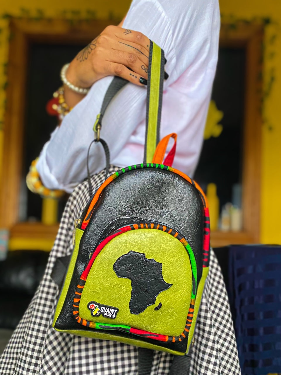 Bitesize Backpack. Cute black and chatreuse green backpack with a map of Africa on the front.