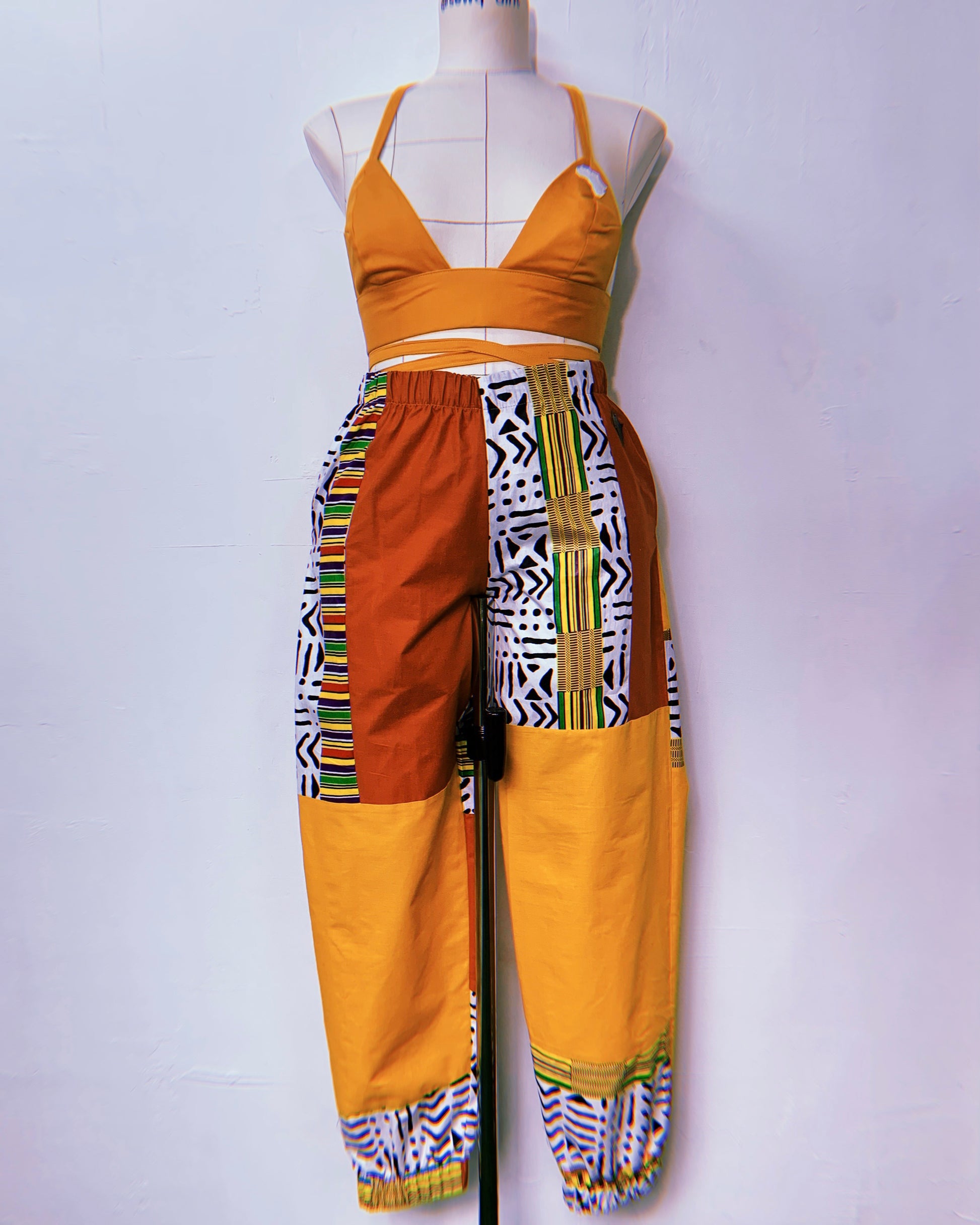 asili jjoggers made by sew quaint with african fabric and solid cotton fabrics with cargo pockets elastic waistbands and elastic hems and sideseam pockets ankara fabric ankara lovers made in jamaica worldwide shipping