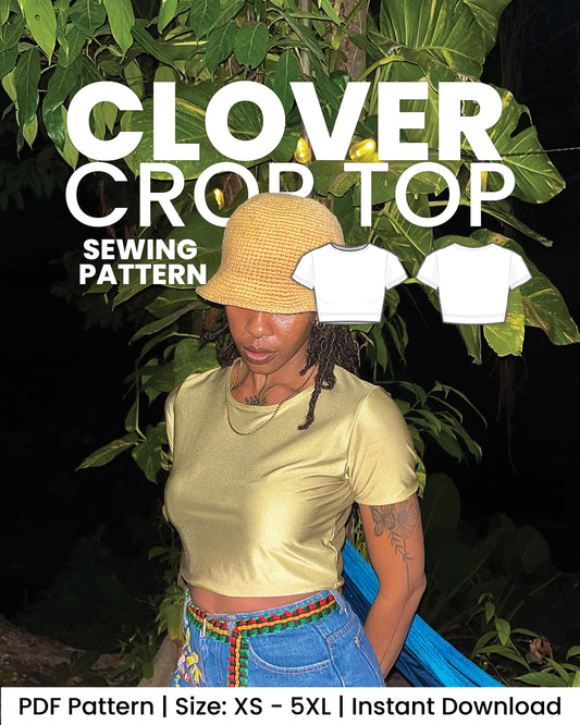 Promotional graphic for a 'Clover Crop Top' sewing pattern, showing a woman wearing a pale yellow short-sleeve crop top and a straw hat against a dark tropical foliage background. Two white t-shirt silhouettes are shown on the right, with text reading 'SEWING PATTERN' and 'PDF Pattern | Size: XS - 5XL | Instant Download'.
